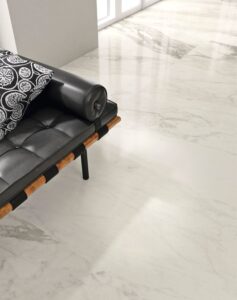 Room with white/cream/gray marble look tile on floor