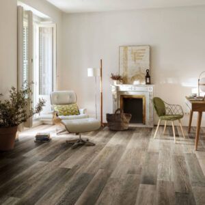 Living room with wood look tile floor, fireplace, recliner, large window