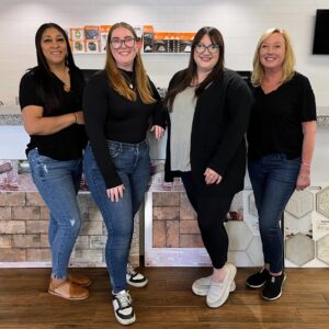 Four women standing together